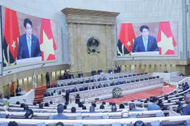 President Luong Cuong delivers a keynote policy address at the plenary session of the Angolan National Assembly on August 7. (Photo: VNA)