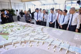 Prime Minister Lawrence Wong looking at a model of Changi Airport Terminal 5 on May 14 (Photo: The Straits Times)