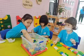 Kindergarten students in Hanoi return to school