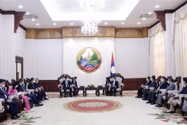 Lao PM applauds partnerships between Vietnamese, Lao ministries