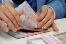 Thai baht surges on prospect of tourism recovery