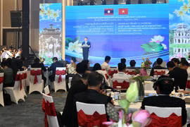 Hanoi, Vientiane promote cooperation in investment, trade, tourism