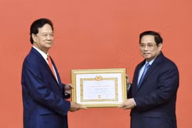Former Prime Minister presented with 55-year Party membership badge