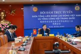 Vietnam, China exchange experience in trade union activities