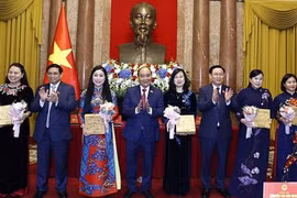 President hosts female officials, NA deputies
