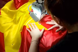 Pride of village sewing national flags