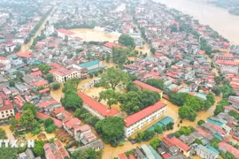 Many areas in Yen Bai province are submerged in water as the Red River's water level rises rapidly. (Photo: VNA)