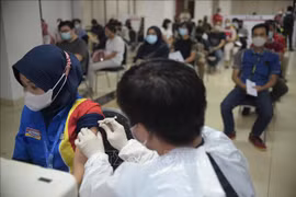 Indonesia expects to see new COVID-19 peak in August