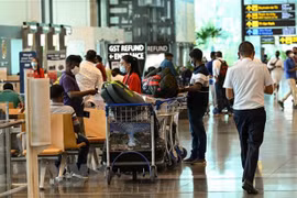 Singapore extends stay-home notice, Malaysia suspends travel bubble