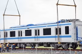 Train carriages of HCM City’s first metro line installed onto trial track
