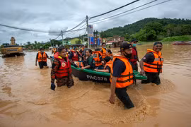 Seven dead, more than 50,000 evacuated in Malaysia floods