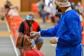 Malaysia records highest COVID-19 deaths ever, Indonesia extends ban on foreign entries
