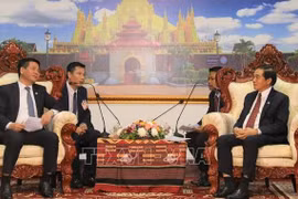 Vietnam, Laos seek to beef up trade, industry and justice ties