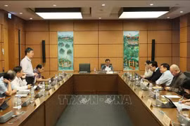 Deputies from the provinces of Dien Bien, Kon Tum, and Vinh Long and Can Tho city discuss the draft amended Law on Corporate Income Tax and the draft amended Law on Special Consumption Tax on November 22. (Photo: VNA)