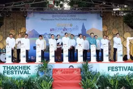Delegates launch the food festival, product exhibition, and distribution event in Laos’s Khammouane province. (Photo: VNA)