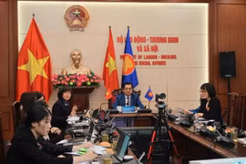 Deputy Minister of Labour, Invalids and Social Affairs Nguyen Ba Hoan (centre) shares about the implementation of commitments on gender mainstreaming and women's empowerment in Vietnam. (Photo: VietnamPlus)