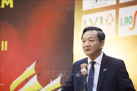 Vietnamese Ambassador to Laos Nguyen Minh Tam addresses the event. (Photo: VNA)