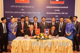 Vietnam, Laos boost cooperation in inspection work