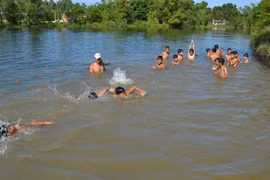 Children in Quang Ngai taught swimming skills in river
