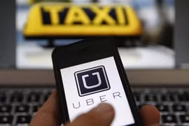 Taxi company Uber Vietnam cuts fares