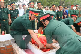 Thirteen soldiers who died in the war against the US were reburied in central Binh Thuan provincial war martyr on July 2. (Photo: VNA)