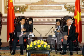 Chairman Le Hoang Quan and Minister Guo Shengkun (L). Source: VNA