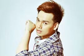 Nguyen Tran Trung Quan, who lost 20 kgs in two months, posing for the cover of his first album Departure. (Photo: VNA)