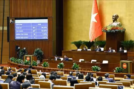 NA deputies vote to pass the Law on Value Added Tax. (Photo: VNA)