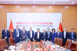 Representatives of the Communist Party of Vietnam (CPV) and the French Communist Party (PCF) attend the 4th theoretical workshop. (Photo: VNA)