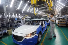 The gap between Vietnam and China in FDI attraction in 2017 was relatively small with 36.4 billion USD for China and over 30 billion USD for Vietnam (Photo: VNA)