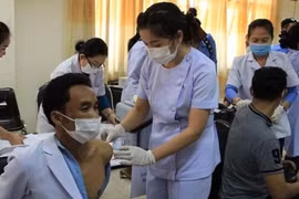 Laos recommends people keep getting COVID-19 vaccination