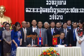 Quang Binh, Lao locality promote cooperation, exchange 