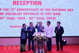 National Day marked in Laos, Mozambique