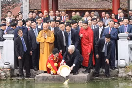 Party, State leader releases carps to bid farewell to Kitchen Gods