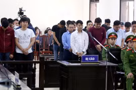 Prison terms reduced for 13 defendants in major gambling ring