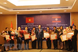 Vietnam, Laos discuss boosting labour, social welfare cooperation 