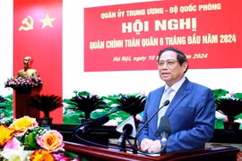 Prime Minister Pham Minh Chinh addresses the national political-military conference on July 10 (Photo: VNA)