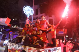 Football fans storm streets to celebrate U23 victory
