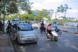 Carpool service GrabShare makes debut in HCM City