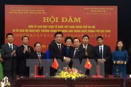 Hanoi VFF Committee boosts ties with Beijing counterpart