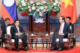 President Tran Dai Quang hails Lao Vice President’s visit