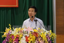 Vietnam, Laos Parties share experience in sustainable development 