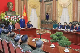 President receives Lao people with contributions to VN revolution