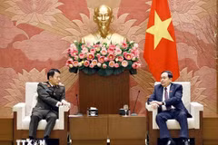 National Assembly Chairman Tran Thanh Man (R) and Minister of Public Security General Luong Tam Quang at a meeting on February 4 (Photo: VNA)