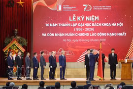 Party General Secretary and President To Lam presents the First-Class Labour Order to Hanoi University of Science and Technology. Photo: VNA