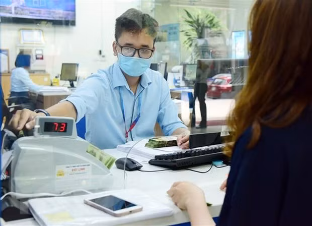 Reference exchange rate up 7 VND ảnh 1