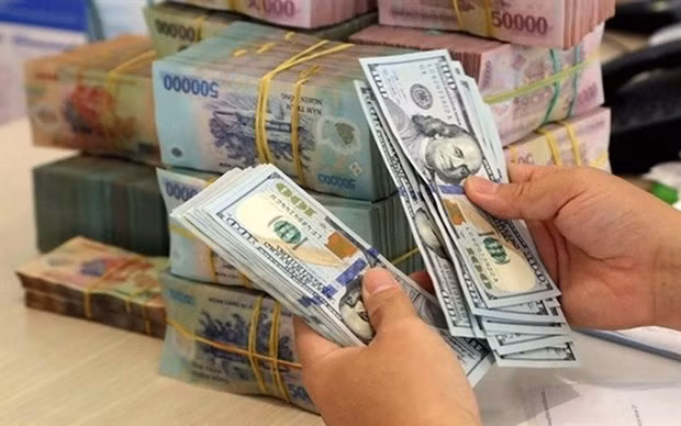 Reference exchange rate down 3 VND on December 1 ảnh 1